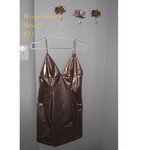 Unique, rosey plastic like material dress